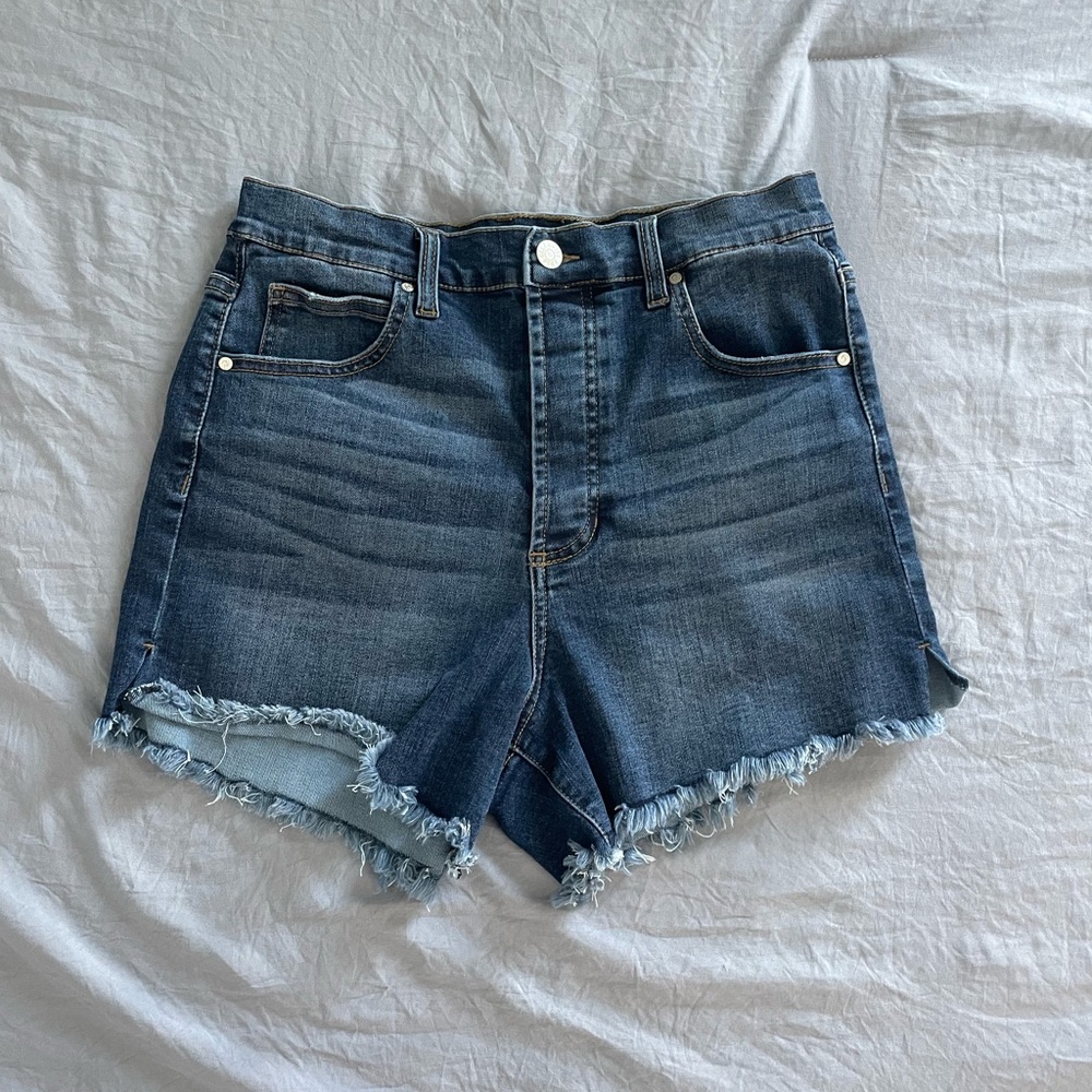 Celebrity Pink Distressed Blue cut off raw hem jean shorts